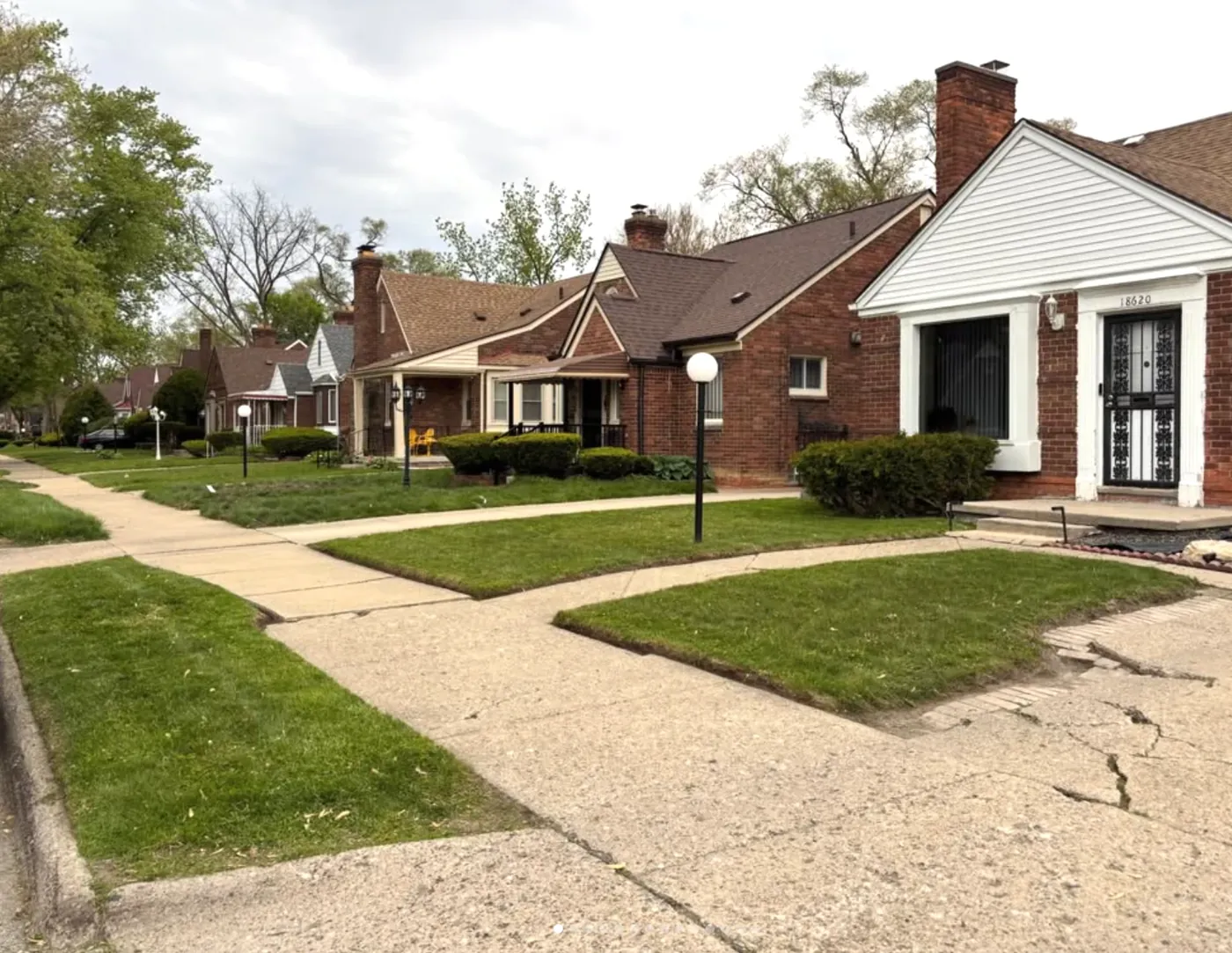 Freshly cut and edged front lawns on a Detroit street in spring