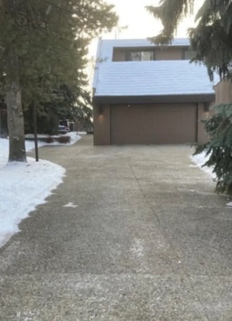 Driveway cleared of snow and salted in winter